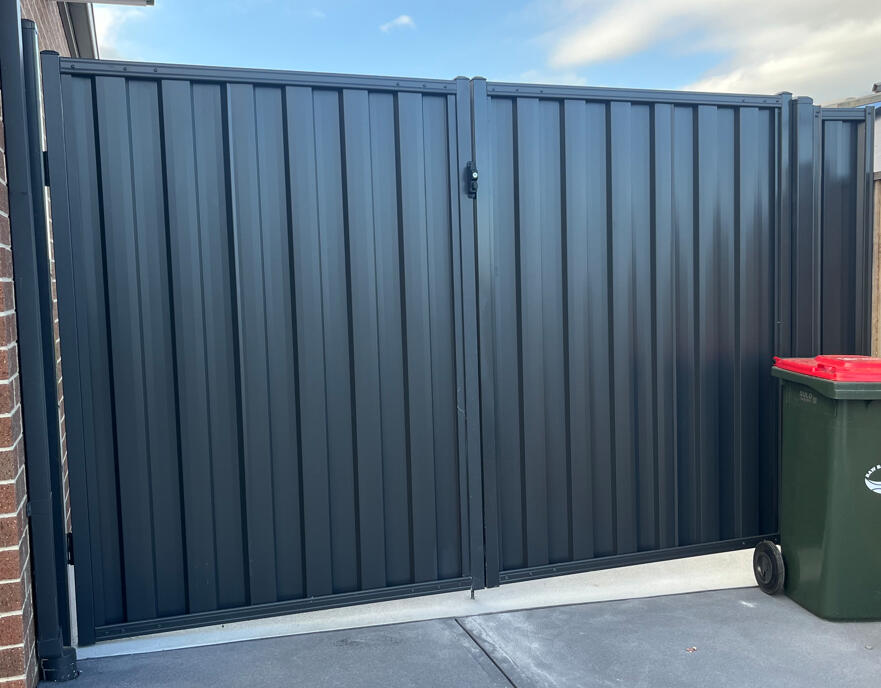 Monument Colorbond double driveway gates with welded frames installed in Warragul. Heavy-duty Monument Colorbond double gates with reinforced welded frames completed for a repeat customer in Warragul, designed for secure driveway access and long-lasting performance.