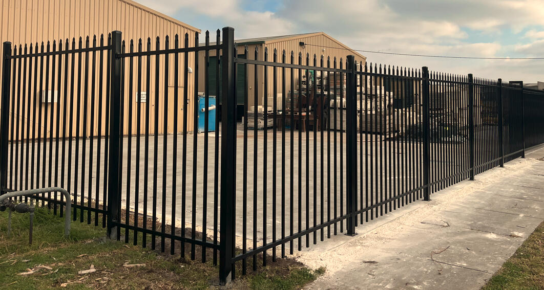 Black 2.1m high spear-top security fencing installed for a commercial factory in Seaford. 2.1m high black spear-top steel security fencing completed for a commercial factory in Seaford, designed for improved perimeter security and industrial property protection.