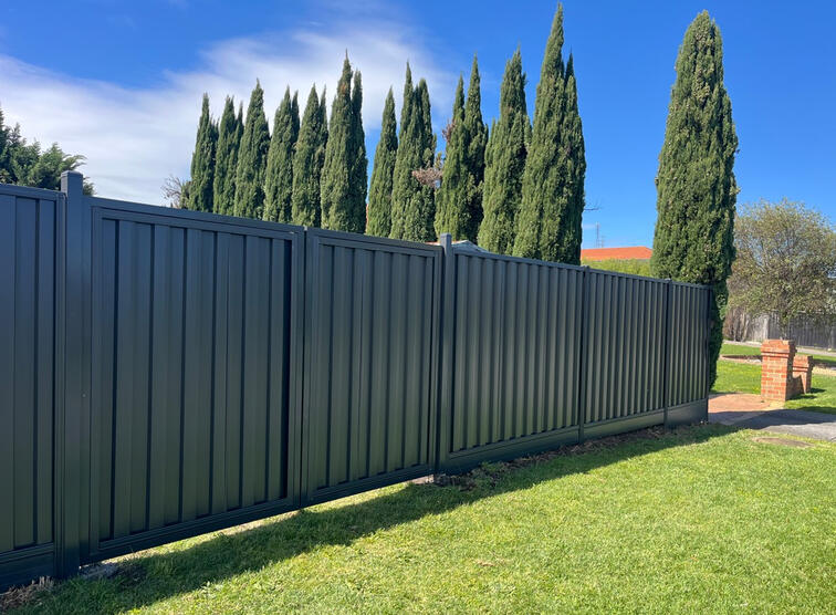 Colorbond fence Woodland Grey with timber sleepers installed in Officer