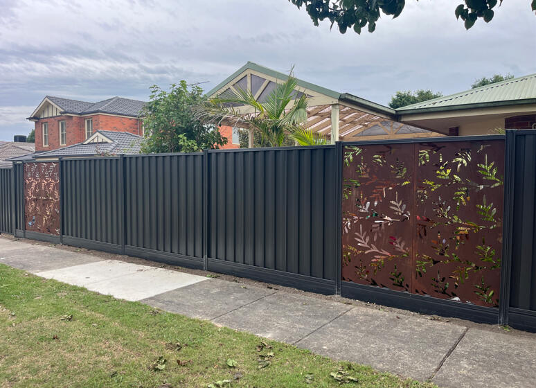 Premium Colorbond fence installed with decorative panels and aluminium sleepers, installed in 2 days.